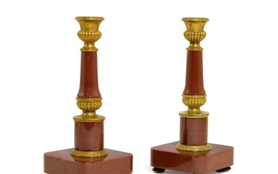 A pair of Russian gilt-bronze and red lazulite candle holders