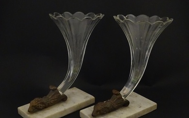 A pair of Victorian epergnes the clear glass flutes with ram...