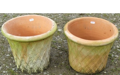 A pair of contemporary terracotta planters in the form of la...