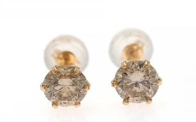 A pair of diamond ear studs each set with a brilliant-cut diamond weighing a total of app. 1.00 ct., mounted in 18k gold. (2)