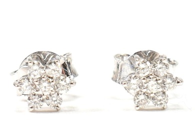 A pair of hallmarked 9ct white gold and diamond daisy cluste...