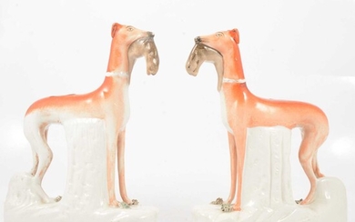 A pair of large Staffordshire models of Greyhounds