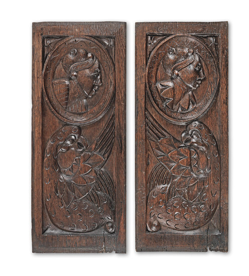 A pair of mid-16th century carved oak 'Romayne'-type panels, circa 1530-60