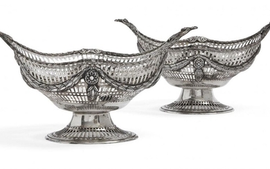 A pair of pierced silver oval baskets, London c.1891 and...