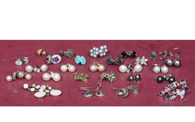 A quantity of various silver and other earrings.
