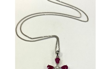 A ruby and diamond cross pendant necklace, set with five pea...
