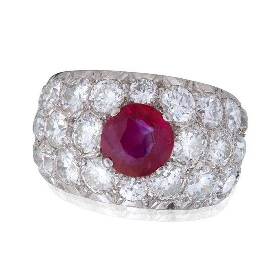A ruby and diamond ring centering a Burma ruby...