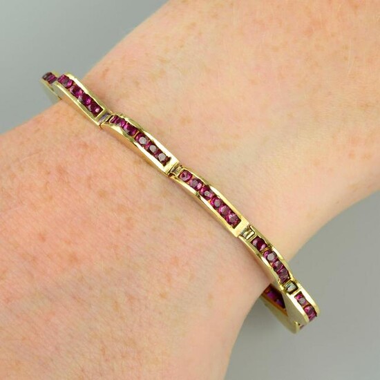 A ruby bracelet, of undulating wave form. Stamped