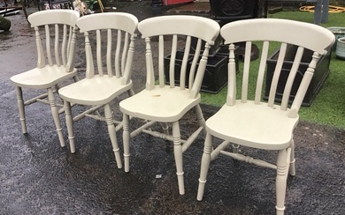 A set of four painted slat back kitchen chairs with...
