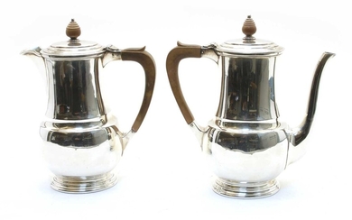 A silver coffee pot and water pot