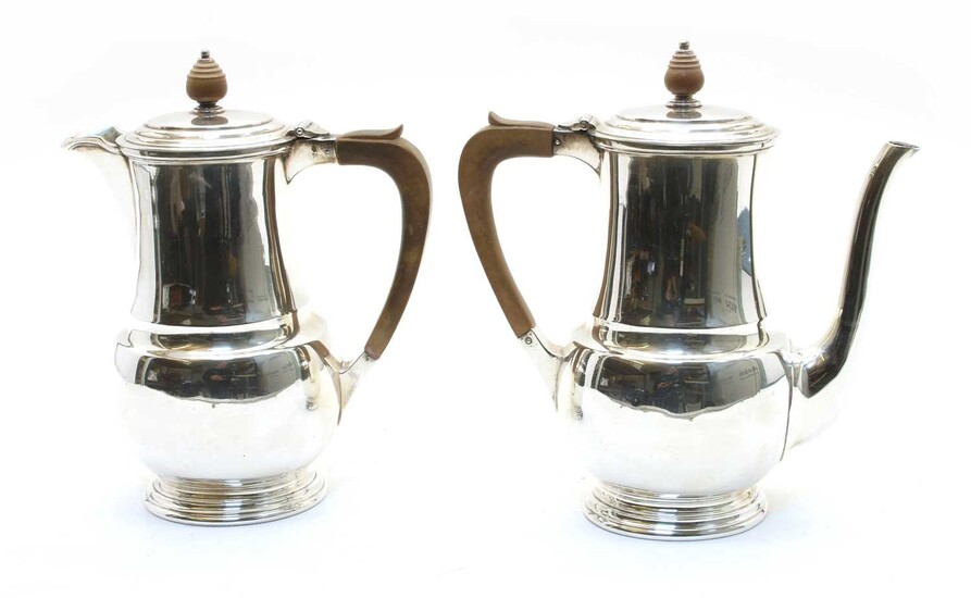 A silver coffee pot and water pot