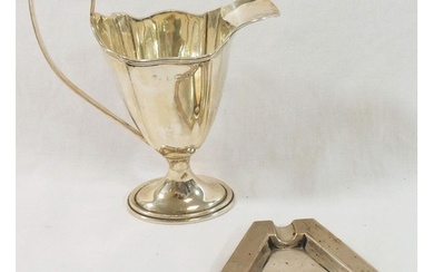 A silver cream jug of Neoclassical design Birmingham 1911, 1...