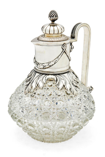 A silver-mounted cut-glass claret jug