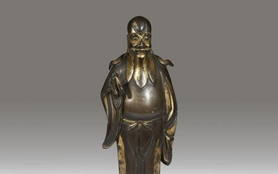 A small Chinese parcel-gilt bronze figure of an