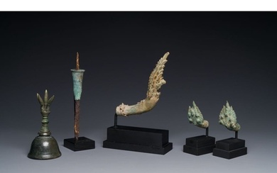 A various collection of bronze khmer palanquin hooks, a bell...