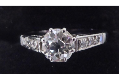 A white coloured metal, single stone, claw set diamond ring ...