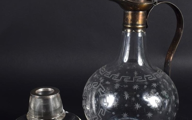 AN EDWARDIAN GLASS DECANTER together with a silver