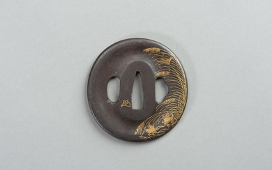 AN IRON TSUBA WITH REED AND LEAF