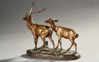 Alfred DUBUCAND (1828-1894) "Cerf et biche près d'une souche" Bronze à patine dorée et brun...