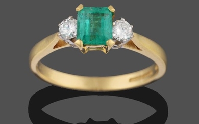 An 18 Carat Gold Emerald and Diamond Three Stone Ring,...
