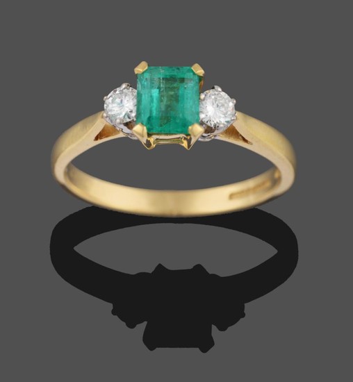 An 18 Carat Gold Emerald and Diamond Three Stone Ring,...