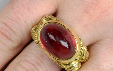 An 18ct gold pink tourmaline dress ring, with scrolling