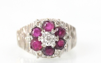 An 18ct white gold untested ruby and diamond cluster ring, t...