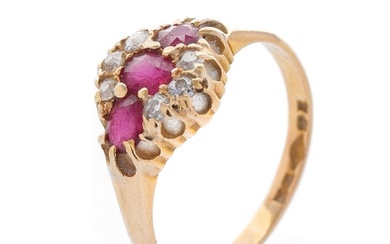 An 18ct yellow gold ladies ring set with three rubies and di...