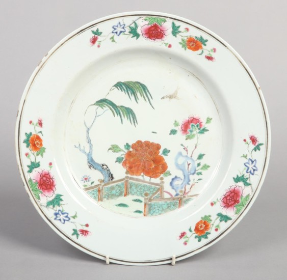 An 18th century Chinese charger. Decorated in coloured ename...