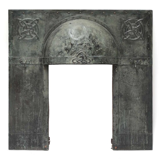 An Arts and Crafts verdigris patinated fireplace insert