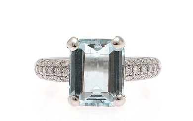 An aquamarine and diamond ring set with an emerald-cut aquamarine, flanked by numerous brilliant-cut diamonds, mounted in 18k white gold. Size 54.