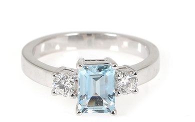 An aquamarine and diamond ring set with an emerald-cut aquamarine weighing app....