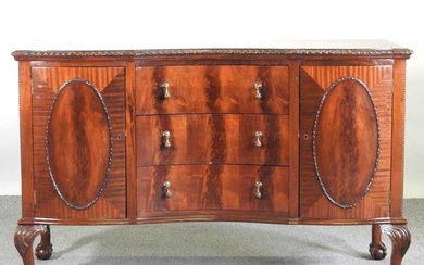 An early 20th century mahogany sideboard, on claw and ball...