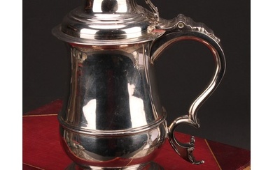 An early George III silver baluster tankard, hinged domed co...