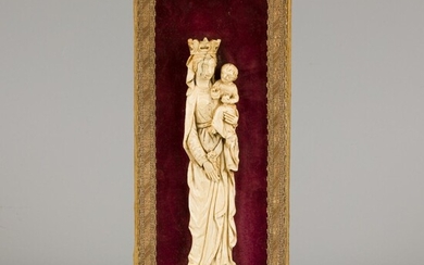 An ivory relief of a standing Madonna with lily mount on red velvet background, ca....