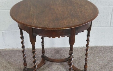 An oak occasional table, Circular top on Barley Twist legs