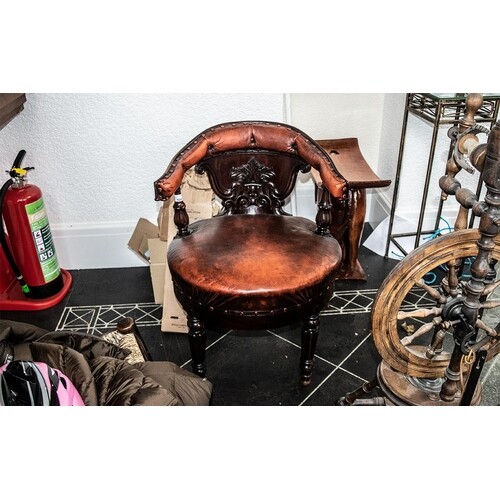 Antique American Captains Chair with a central carved back s...