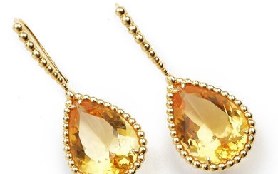 Boucheron: A pair of citrine ear pendants “Serpent Bohème” each set with a pear-shaped citrine weighing a total of app. 19.75 ct., mounted in 18k gold. Case.
