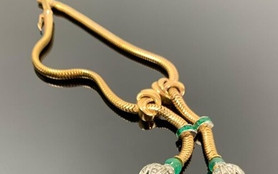 Bracelet en or jaune et platine, maille tubogaz, orné de pompons formés d'émeraudes et de diamants.