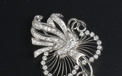 950-thousandths platinum brooch featuring an openwork ribbon set with round brilliant diamonds of approximately 0.1 ct to 0.3 ct.