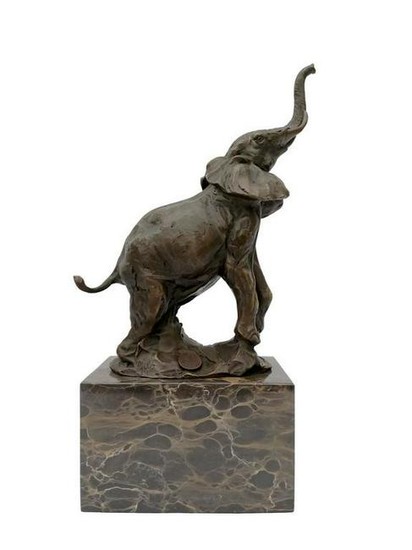 Bronze sculpture of an elephant on marble pedestal