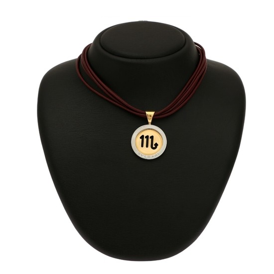 Bulgari: A pendant of gold and white gold on a five-strand bordeaux leather necklace with a clasp of silver-toned metal. L. incl. eye-let 4.3 cm. L. 39 cm. (2)