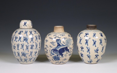 China, a pair of soft paste blue and white 'one hundred boys' jars and A 'buddhist lion' jar, 19th century