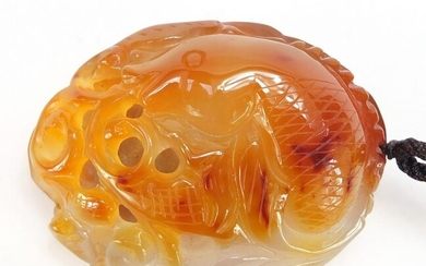Chinese agate pendant carved with a fish, 7.5cm high