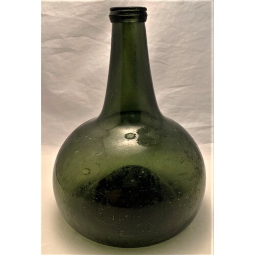 Dutch onion shaped wine bottle, early 17th century, dark gre...