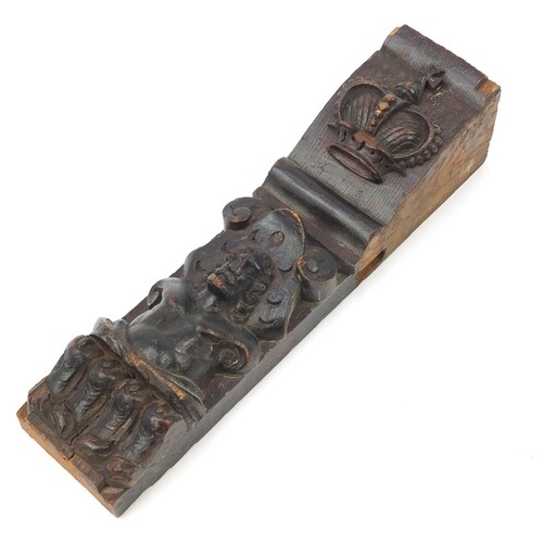 Early 17th century oak bracket carved with a gentleman in a ...