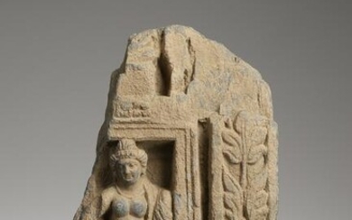 FEMALE SCULPTURE WITH FLORAL MOTIFS