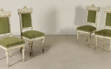 Four chairs in carved and painted and decorated wood