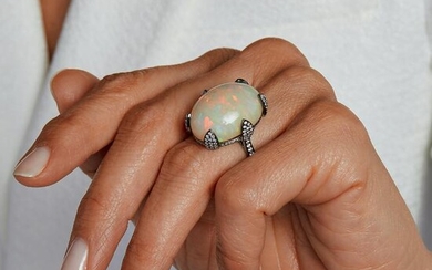 French assay mark, an opal, diamond and gold ring.