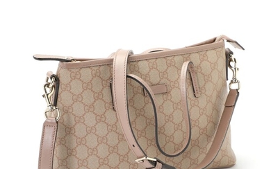 NOT SOLD. Gucci: A "2 Way Tote Bag" of dusty rose coloured and beige coated...